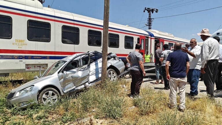 Train Collides with Car: 3 Injured