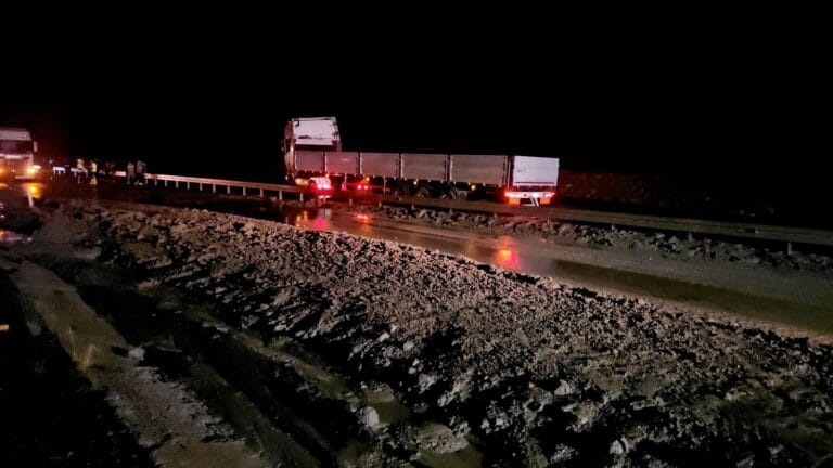 Landslide on the Highway: Truck Stuck in Barriers